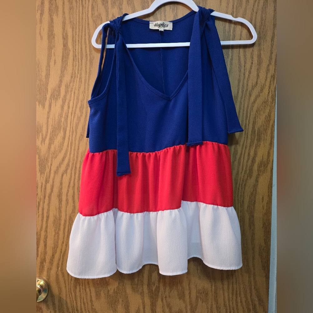 Very cute red, white, and blue flowy summer blouse. Worn once for 2 hours.
